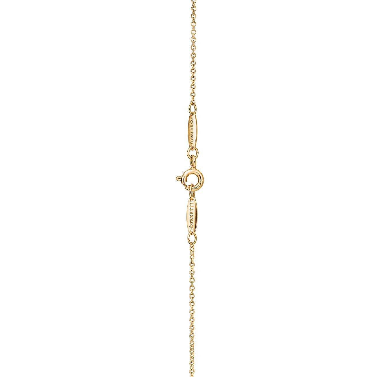 TIFFANY  ELSA PERETTI® OPEN HEART PENDANT IN YELLOW GOLD, 11 MM